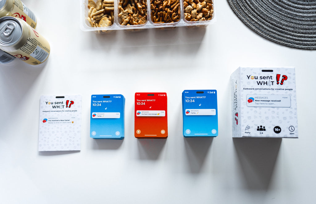 You Sent What!? party card game set on table with snacks and drinks — includes game box, instruction booklet, and decks for fun group game night.